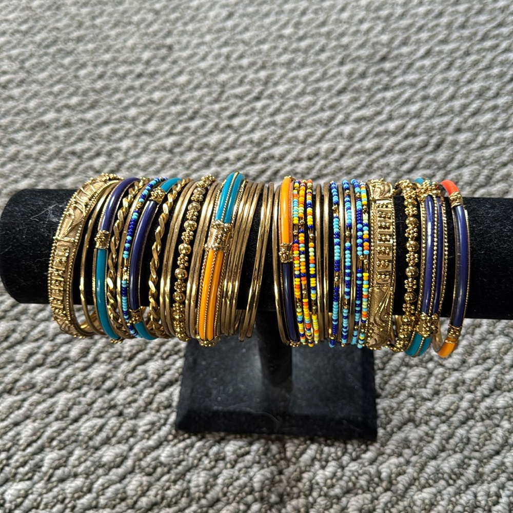 35 individual Costume bracelets sold as a set.